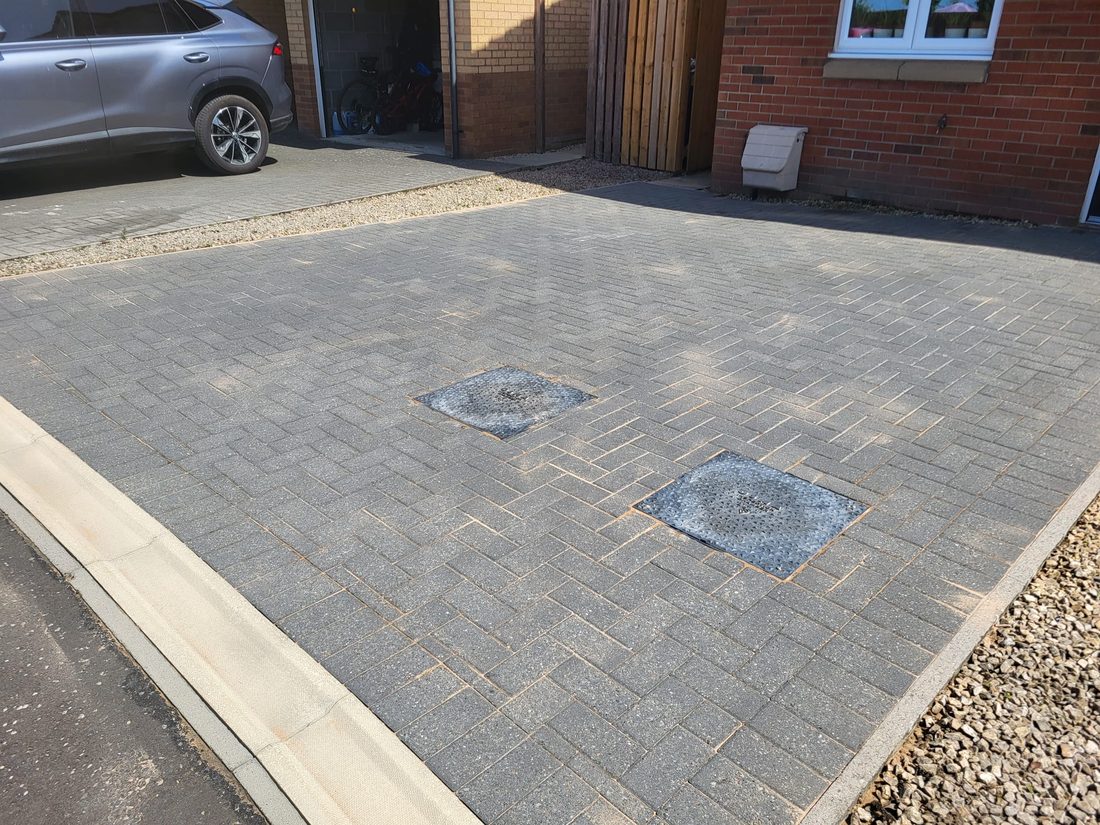 Driveway after cleaning, block paving restored