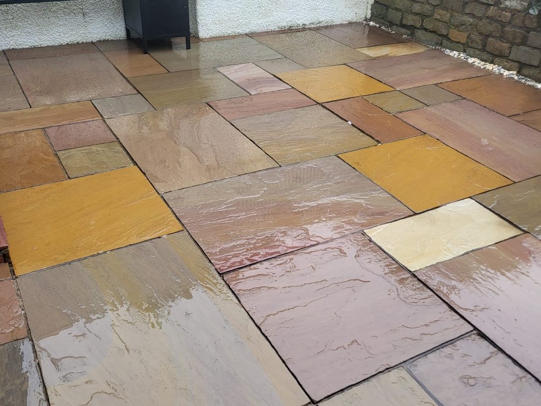 Patio after cleaning, Indian sandstone slabs restored